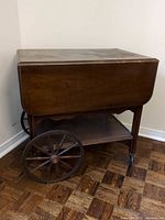 Cart with leaves down, showing large spoked wheel and lower shelf