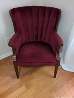 Full view of armchair showing fabric, frame, legs