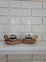 Both hurricane candle holders side by side on mantel
