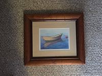 Front view showing rowboat artwork, mat and wooden frame
