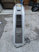 Front view of Lasko HVB tower fan showing grille and logo