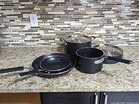 Full cookware set on countertop showing all pieces