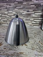 Side view of stainless steel conical kettle