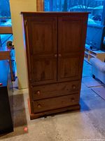 Front view closed showing full armoire
