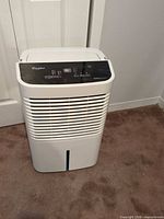 Front view showing grille, water-level window and overall condition