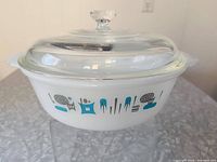 Side view showing dish with lid and full Blue Heaven pattern