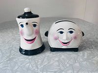 Front view of both shakers showing faces and overall condition