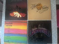 All four album covers laid out