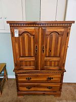 Front view showing doors and drawers