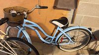 Full side view of blue Supercycle Cruiser Classic bicycle with basket