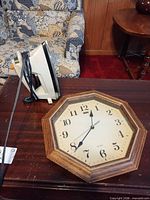 Deko wall clock and GE iron on table