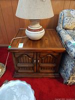 Front view showing wood end table, lamp sitting on top (lamp not included)
