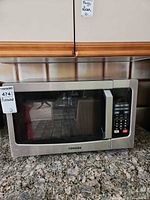 Front view of Toshiba microwave on countertop