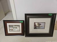 Both framed prints standing side by side