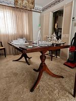 Full side view of table showing pedestal base, top surface, finish, and overall height