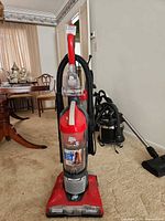 Front full view of red Dirt Devil Power Flex upright vacuum