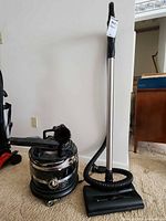Canister vacuum with hose, wand and power nozzle upright