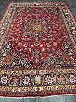 Full view of rug showing pattern and borders