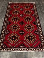 Full view of rug showing entire pattern and borders