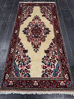 Full view of rug on dark floor