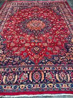 Full view of entire rug showing pattern and borders