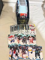 Open storage box filled with vertically stacked hockey cards