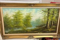 Front view of framed landscape oil painting