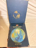 Book partially withdrawn from slipcase showing front cover and slipcase exterior