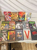 All 14 DVD cases laid out showing front covers