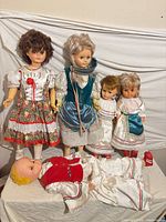 Group shot of all five dolls in folk costumes