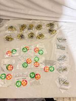 overview showing multiple sealed dice bags, sealed chip pairs, VSTAR markers