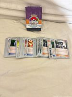 All 40 trainer cards fanned with deck box