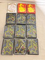 All 12 sealed sleeve packs laid out showing designs and quantities