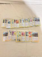 All cards laid out showing faces and holo pattern