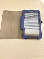 Tablet open in folio case, screen and front bezel visible