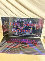 Both glass panels: The Sign of Zodiac (top) and Roaring 20s (bottom) laid out together