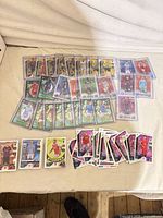 Overview of over 100 Topps Match Attax cards, many in top-loaders