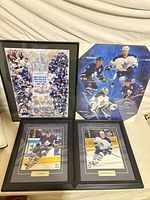 All four framed prints standing together