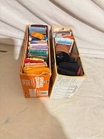 Two boxes filled with folded trim packages