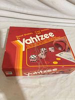 Front of Yahtzee box showing branding and artwork