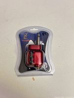 Front view of sealed Adeline red preamp showing controls and 1/4 in plug