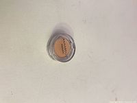 Front view of eyeshadow pot showing Annabelle branding and product color