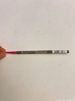 Full view of Annabelle Universal Taupe brow pencil showing branding and cap
