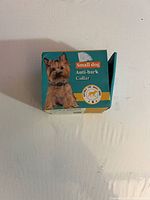 Front of retail box showing product name and small dog image