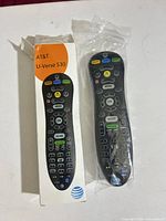 Front view of remote in bag with box