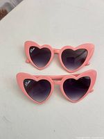 Front view of both Babe heart sunglasses