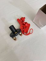 Battery disconnect switch with red keys and box visible