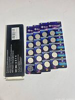 Five unopened 4-packs of Beidongli CR2025 coin cell batteries and outer box