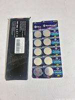 Front view of blister card showing 10 Beidongli CR2430 batteries and outer sleeve