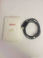 Cable coiled beside Benfei sleeve front